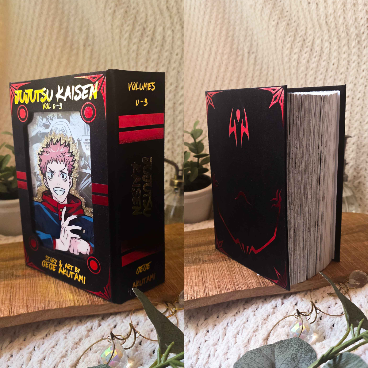A custom hardcover book styled as the manga volume 1 of Jujutsu Kaisen, shown in a split view of the front cover and the spine. The book is decorated with black and red graphics, featuring a printed illustration of Satoru Gojo.