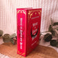 Handmade rebound of House of Earth and Blood in red bookcloth with red, white, and gold accents